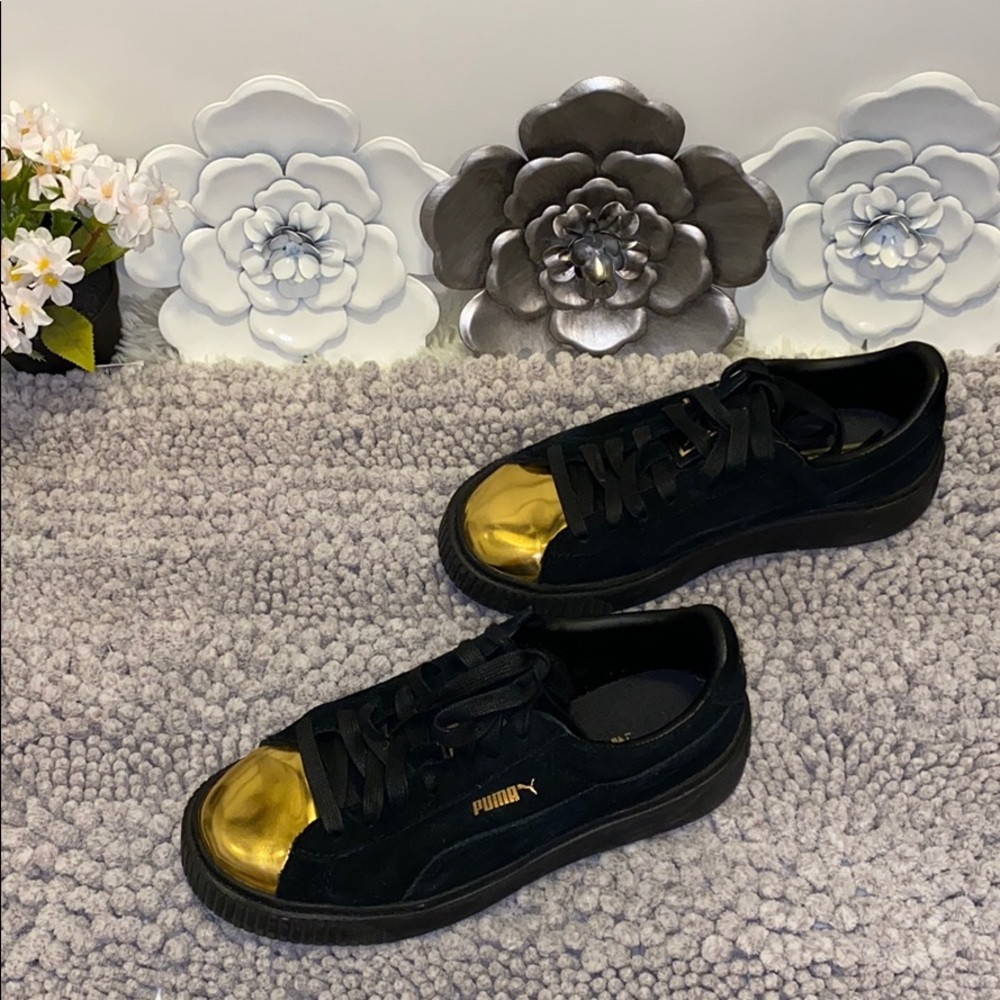 Puma black and gold platform sneakers
